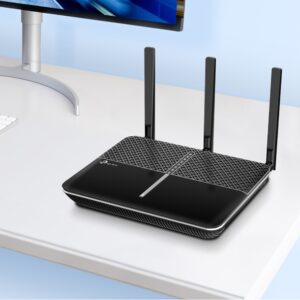TP-Link Archer VR600 AC2100 modem router displayed in a desktop setup