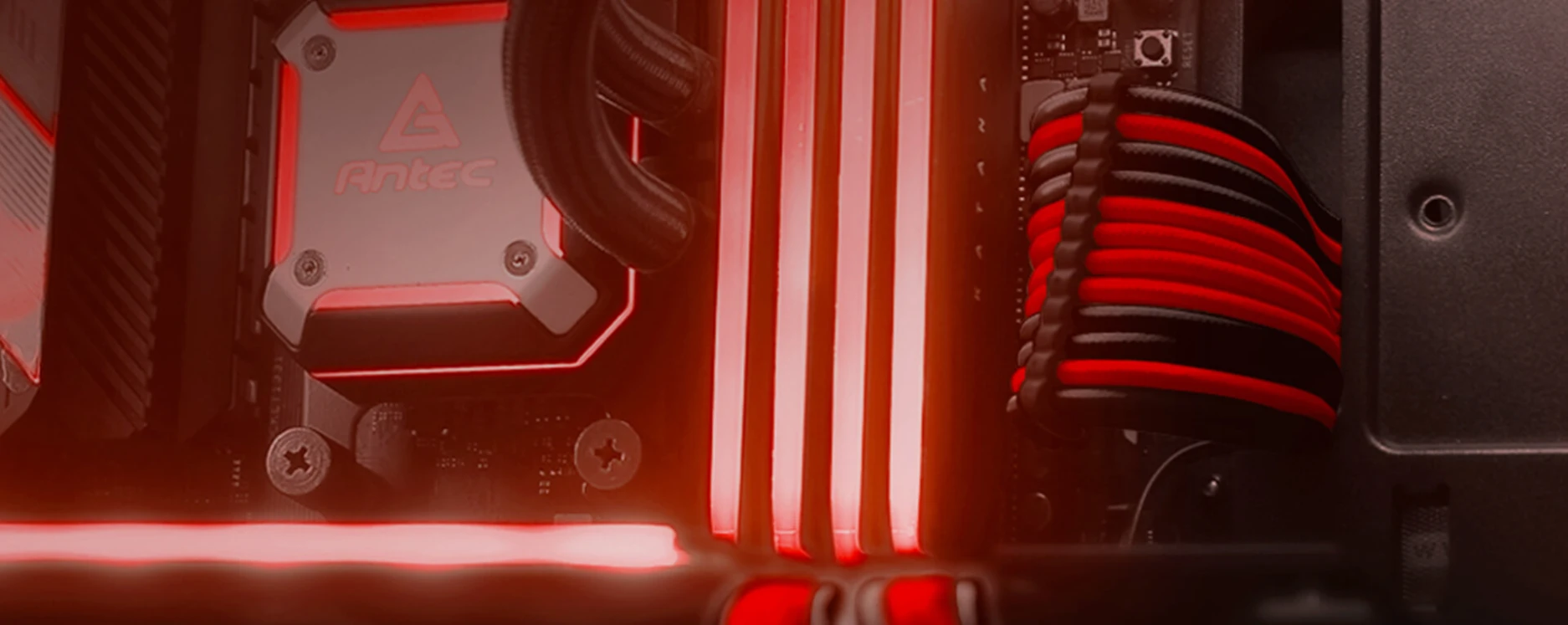 Antec red and black sleeved cables in a PC build with RGB lighting interior