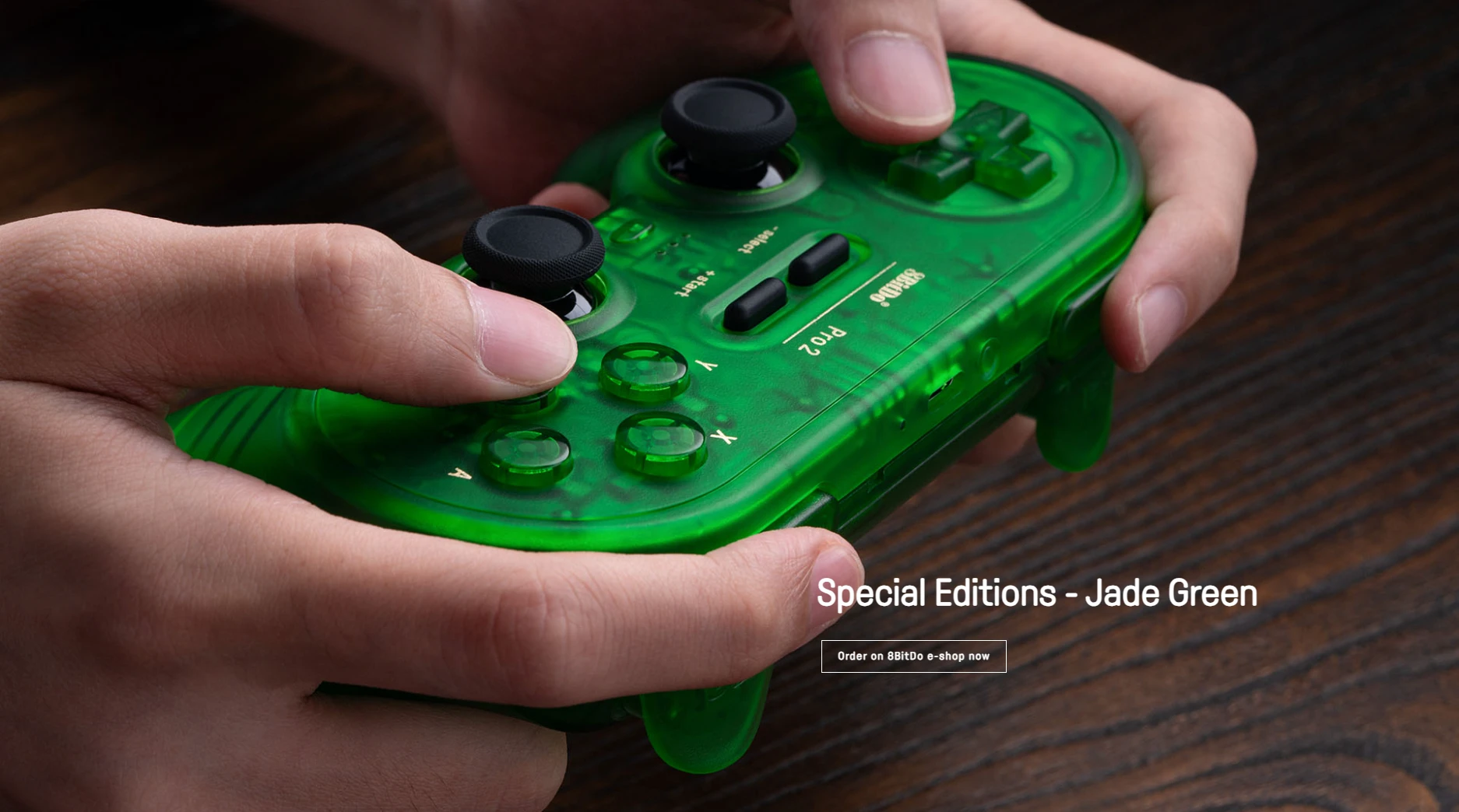 8BitDo Pro 2 Bluetooth wireless controller in translucent Jade Green with dual analog sticks and D-pad