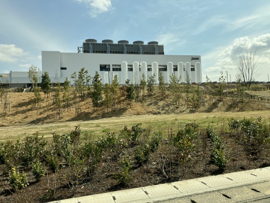Exterior of the JASM semiconductor manufacturing facility in Kumamoto, Japan, illustrating the industrial scale of semiconductor manufacturing
