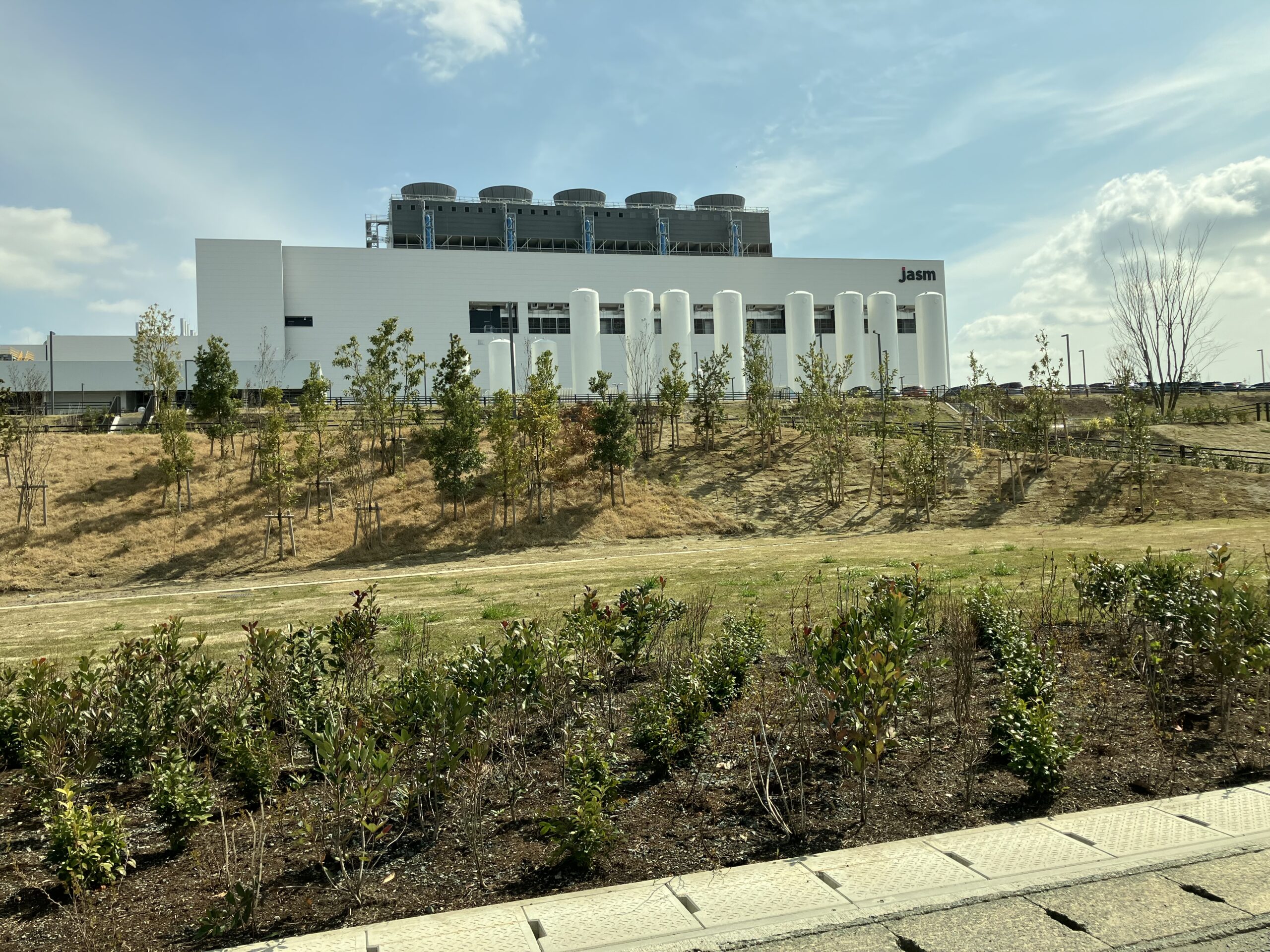 Exterior of the JASM semiconductor manufacturing facility in Kumamoto, Japan, illustrating the industrial scale of semiconductor manufacturing